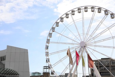 Photo of Picturesque view of beautiful Ferris wheel in city