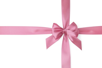 Photo of Pink satin ribbon with bow on white background, top view