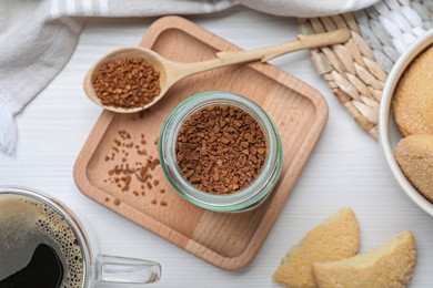 Flat lay composition with instant coffee on white wooden table