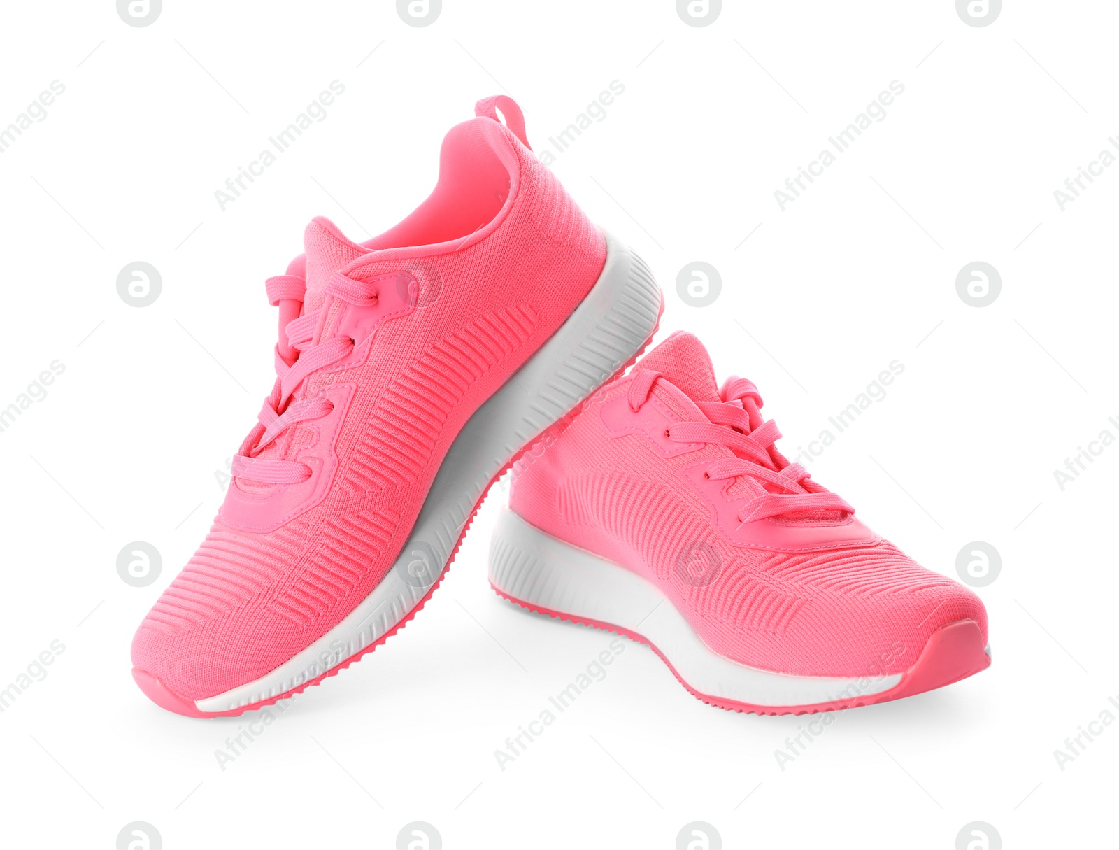 Photo of Pair of stylish pink sneakers on white background