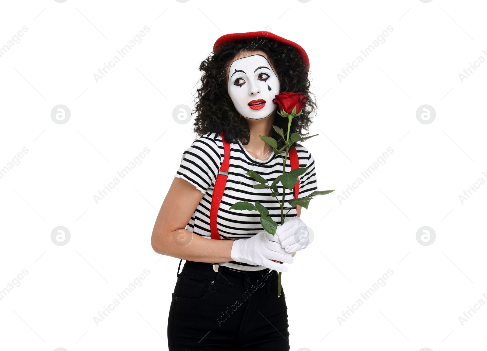 Photo of Funny mime with red rose posing on white background