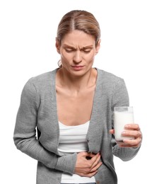 Photo of Woman with glass of milk suffering from lactose intolerance on white background