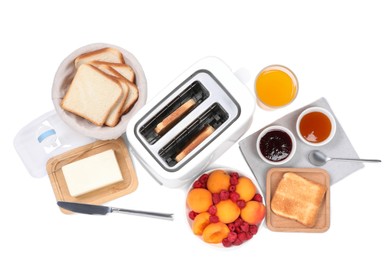 Modern toaster, bread, butter, fresh fruits and jams on white background, top view