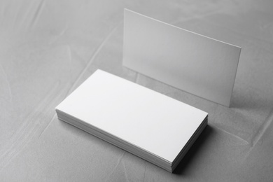 Photo of Stack of empty sheets on grey stone table. Mock up for design