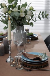 Photo of Festive table setting with beautiful tableware and decor indoors