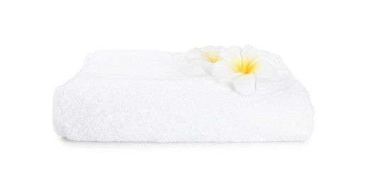 Photo of Terry towel and plumeria flowers isolated on white