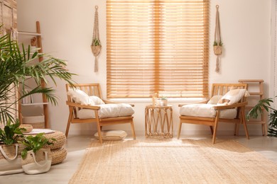 Stylish living room interior with wooden furniture and beautiful houseplants