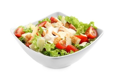 Image of Delicious fresh Caesar salad in bowl on white background 