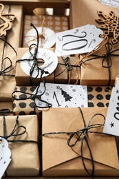 Photo of Set of gifts for Christmas advent calendar with tags, closeup