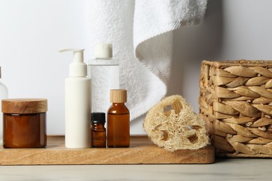 Photo of Different bath accessories and personal care products on light table