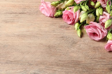 Photo of Happy Mother's Day. Beautiful flowers on wooden table, space for text
