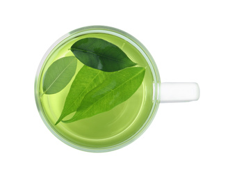 Photo of Cup of aromatic green tea with leaves isolated on white, top view