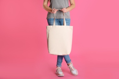 Photo of Woman with eco bag on color background. Mock up for design