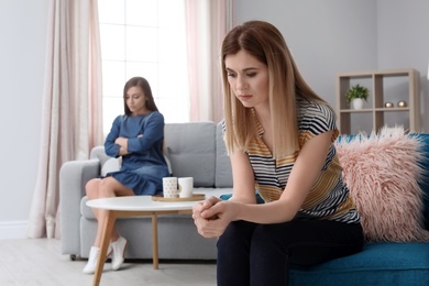 Photo of Unhappy women at home after arguing