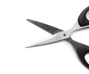 Photo of Pair of sharp scissors on white background