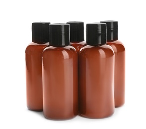 Photo of Mini bottles with cosmetic products on white background. Hotel amenities