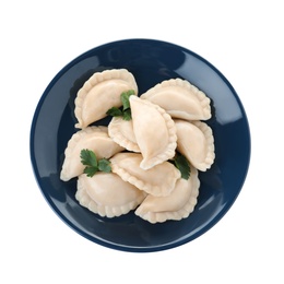 Photo of Plate of tasty dumplings served with parsley on white background, top view