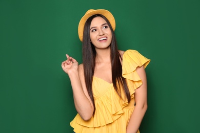 Photo of Portrait of beautiful young woman in stylish clothes on color background