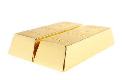 Photo of Precious shiny gold bars on white background