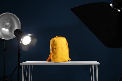 Photo of Shooting of bright backpack for product promotion in photo studio