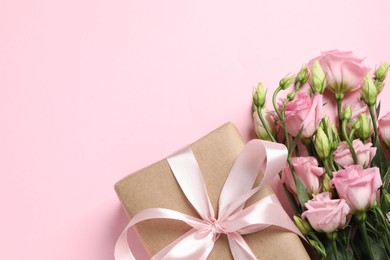 Photo of Happy Mother's Day. Beautiful flowers and gift box on pink background, flat lay. Space for text