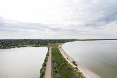 Image of Beautiful aerial view of spit in river on cloudy day