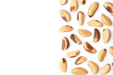 Photo of Composition with Brazil nuts and space for text on white background, top view