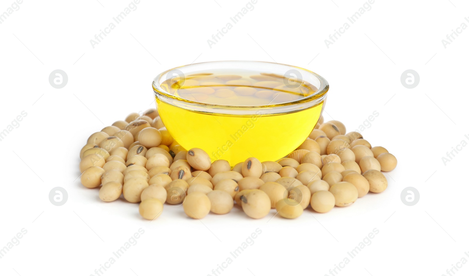 Photo of Glass bowl of oil with soybeans on white background