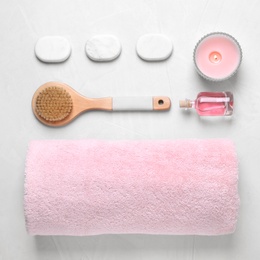 Flat lay composition with spa accessories on light background