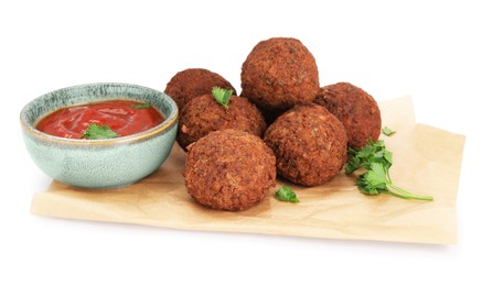 Delicious falafel balls, sauce and parsley on white background. Vegan meat products