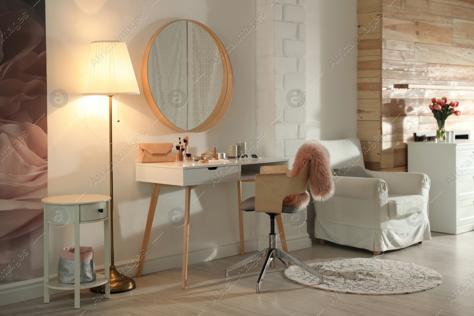 Photo of Stylish room interior with dressing table and mirror