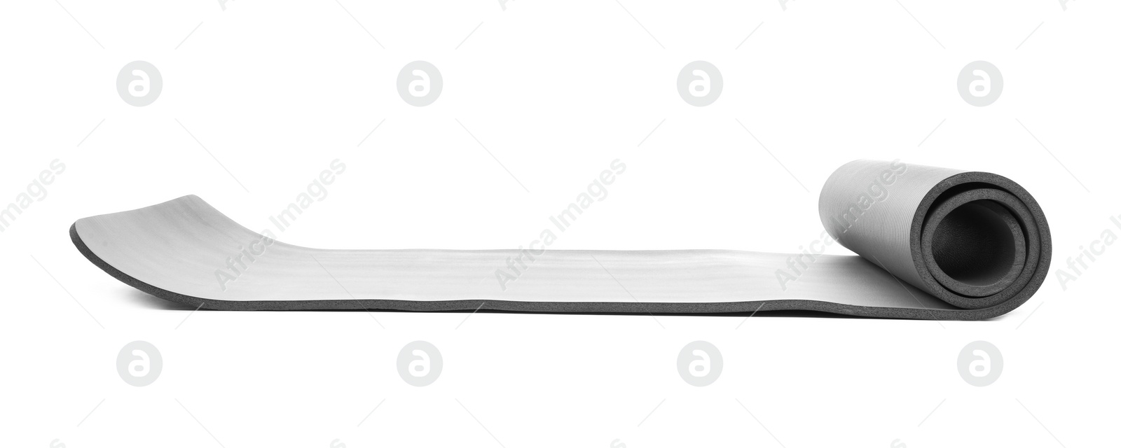 Photo of Rolled grey yoga mat on white background