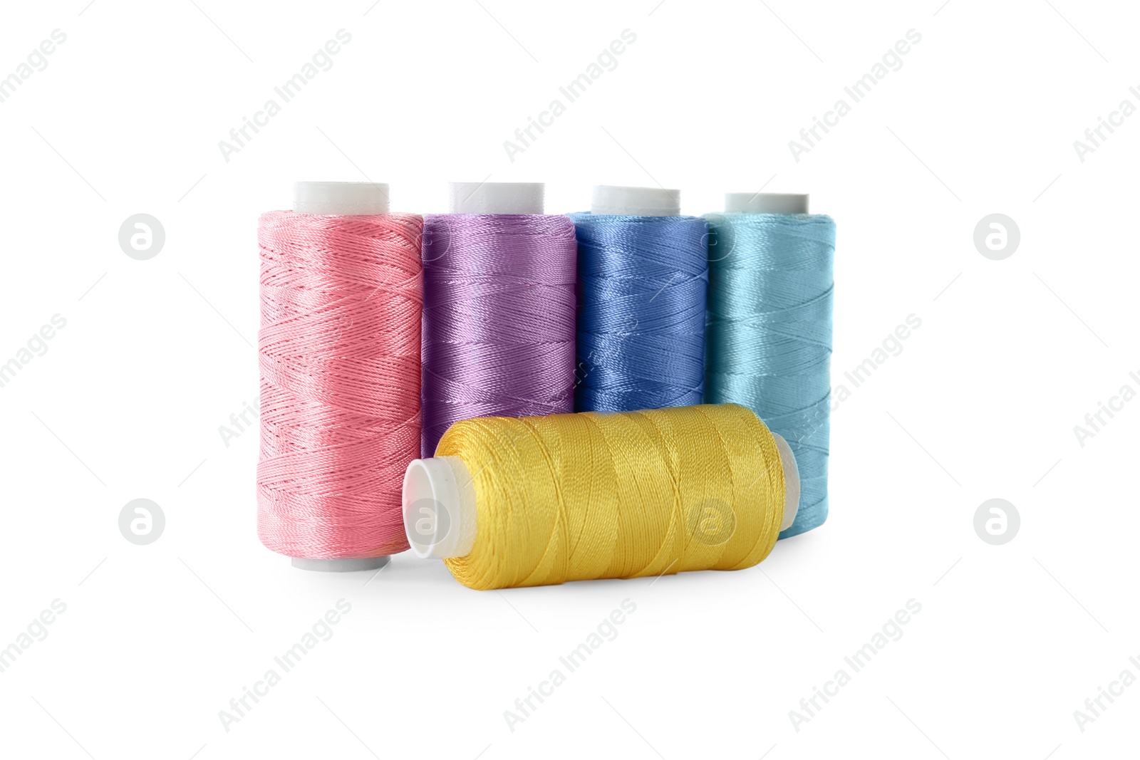 Photo of Set of color sewing threads isolated on white