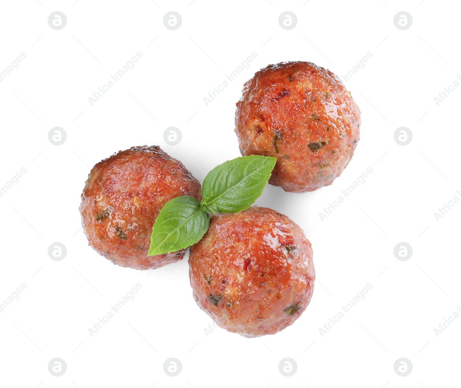 Photo of Tasty cooked meatballs with basil on white background, top view