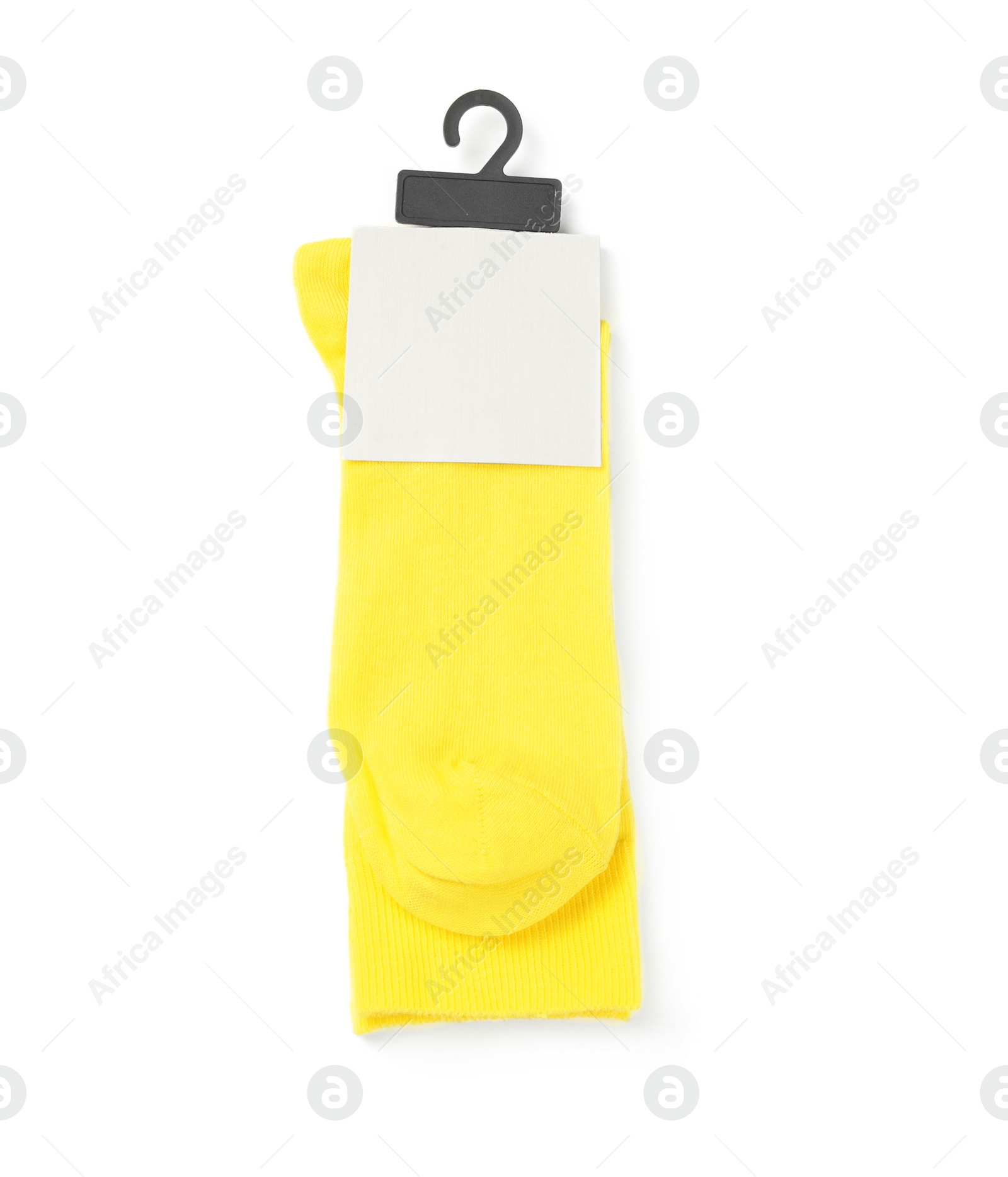 Photo of Yellow socks on white background, top view