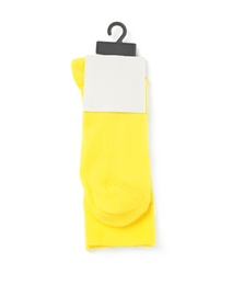 Yellow socks on white background, top view