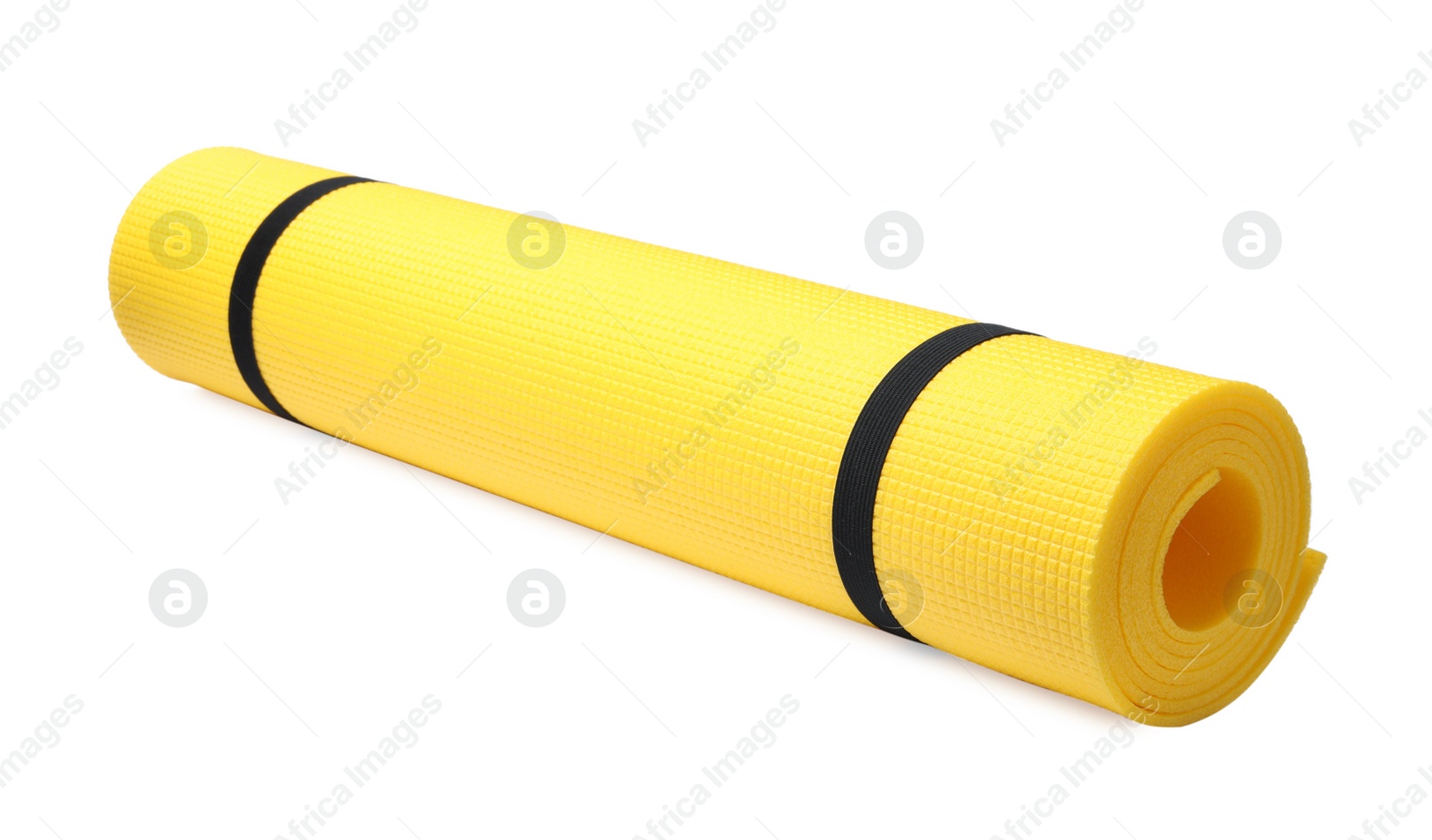 Photo of Rolled yellow camping mat isolated on white