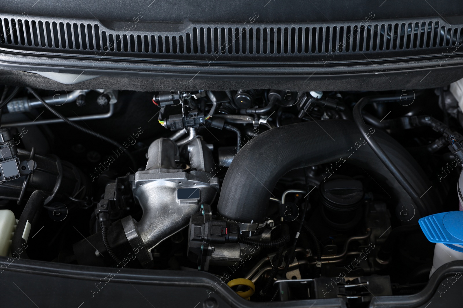 Photo of Closeup view of engine bay in modern auto