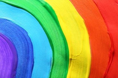 Photo of Rainbow drawn by different paints as background, closeup