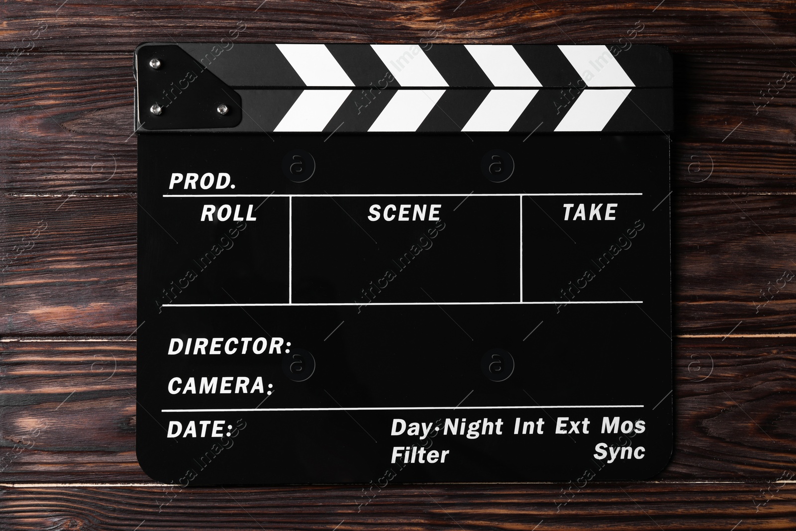 Photo of One clapperboard on wooden table, top view