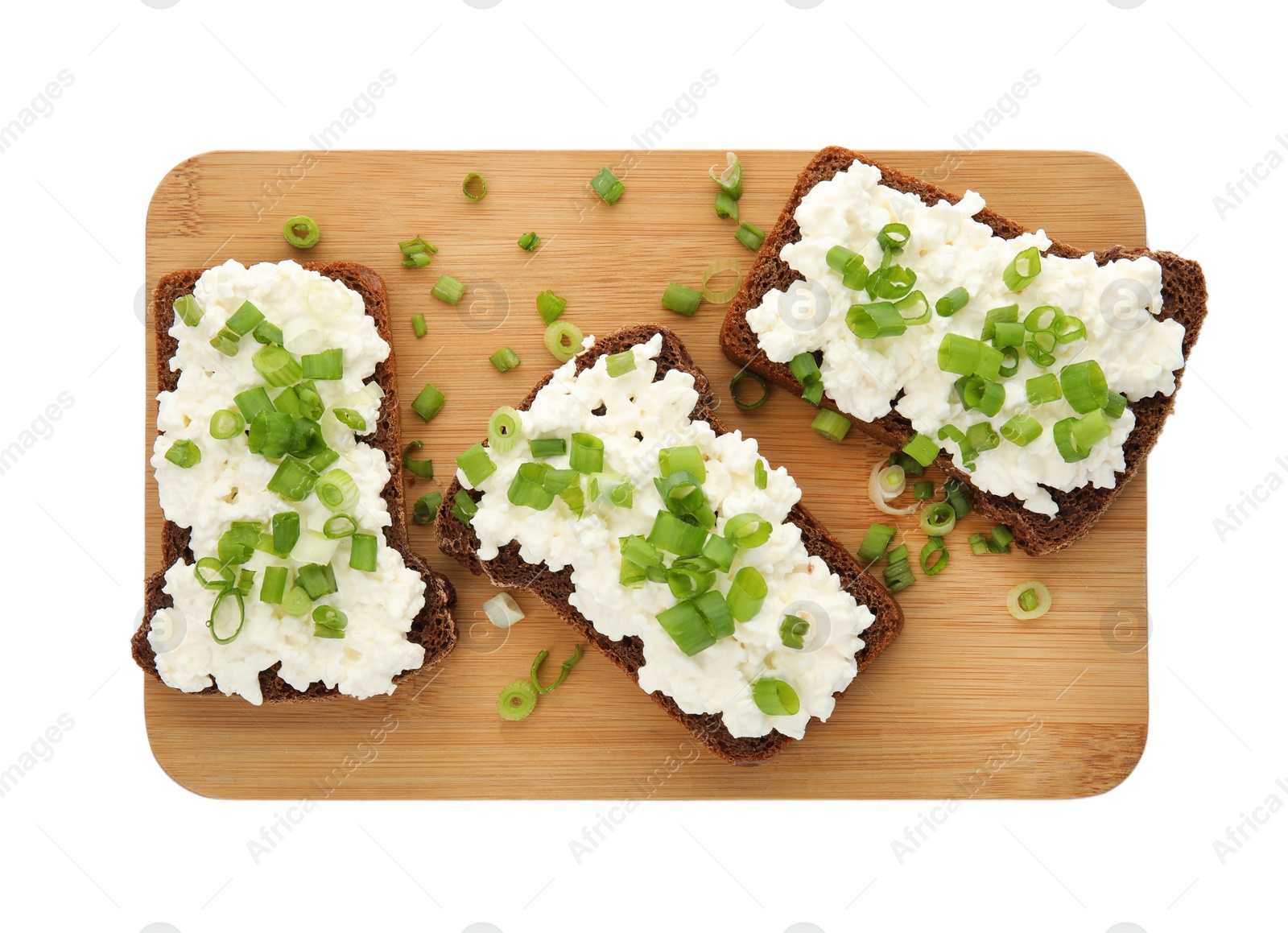 Photo of Bread with cottage cheese and green onion on white background, top view