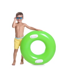 Cute little boy with inflatable ring on white background