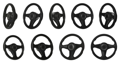 Image of Set with black steering wheels on white background 