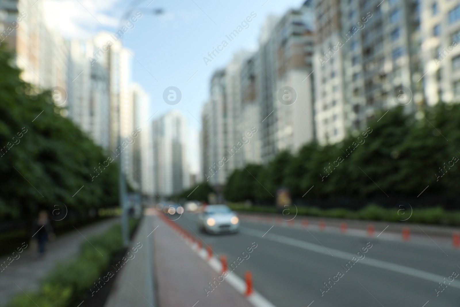 Photo of KYIV, UKRAINE - MAY 21, 2019: Blurred view of modern housing estate in Pecherskyi district on sunny day