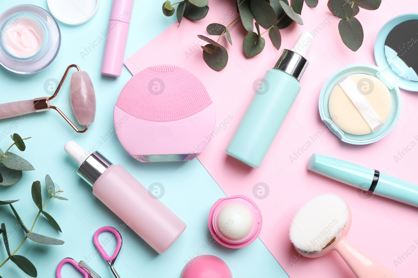 Photo of Flat lay composition with different skin care and makeup products on color background