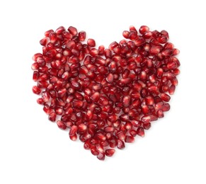 Photo of Heart made of tasty pomegranate grains isolated on white, top view