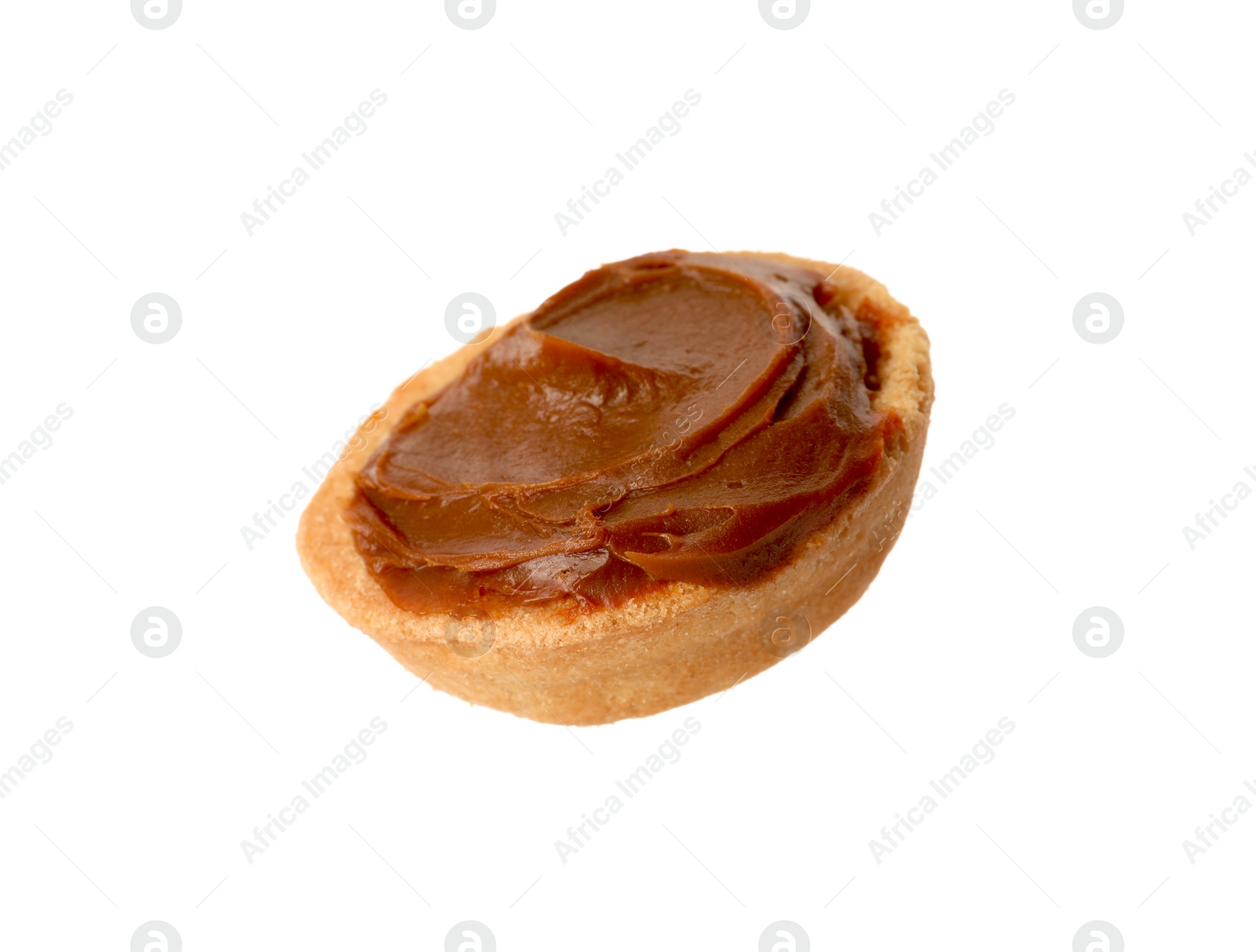 Photo of Half of delicious nut shaped cookie with boiled condensed milk isolated on white