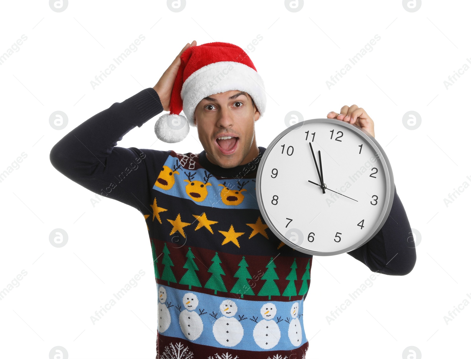 Photo of Man in Santa hat with clock on white background. New Year countdown