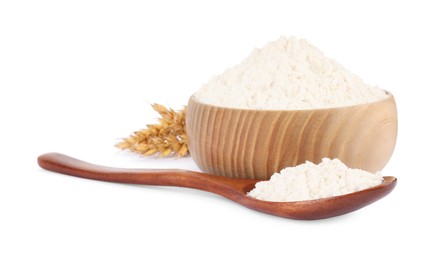 Photo of Wooden bowl and spoon with wheat flour isolated on white