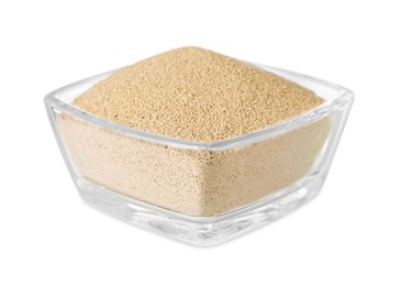 Glass bowl of active dry yeast isolated on white